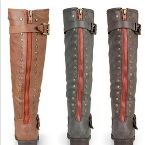 Brown fur lined zip up brown boots with red zipper